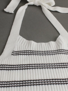 White ribbed knit halter top with black stripes featuring neck tie detail for summer