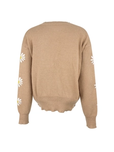 Detail view of camel knit cardigan back with white daisy embroidery and ribbed cuffs