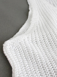 Close-up of white mesh knit vest for women featuring breathable hollow-out summer fabric