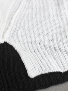 Close-up of black and white rib-knit fabric texture on this two-piece beach vacation set