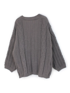 Women's dark grey cable knit oversized sweater with long sleeves in a flat lay view
