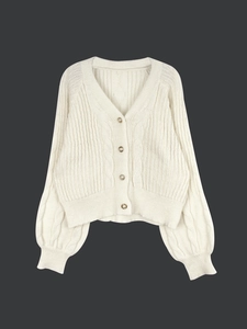 Women's cream knit cardigan featuring cable stitch lantern sleeves and pearl gold buttons