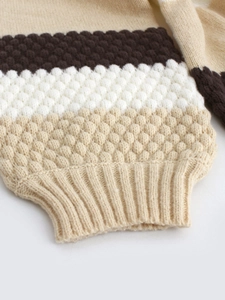 Chunky knit cardigan featuring color block design and textured honeycomb stitch details