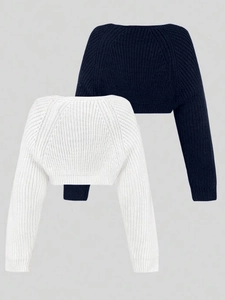 Close-up of ribbed knit bolero shrug texture in white and navy blue vacation style