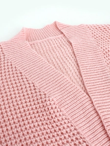 Pink waffle knit cardigan for women featuring a soft V-neckline and breathable texture