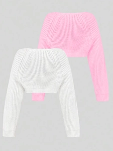 Detail of ribbed knit cropped bolero sweaters in pink and white for summer beach wear