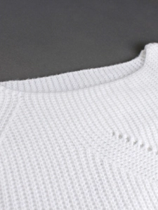 Women's white hollow knit long sleeve sweater with classic ribbed crew neck detail