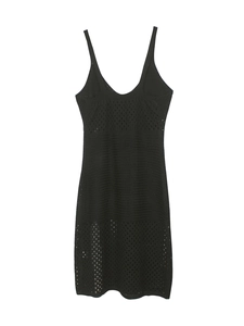 Detailed close-up of black knitted maxi dress with hollow-out texture and scalloped hem