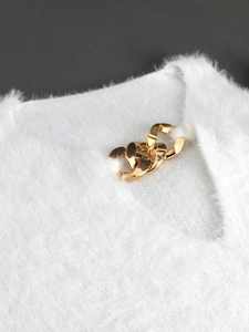 White plush knit sweater with oversized gold metal chain neckline detail for women