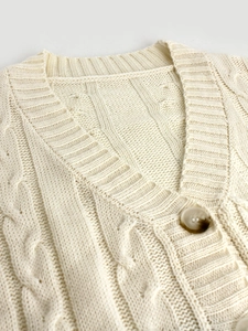 Women cable knit cardigan in cream white with marble button closure and ribbed trim detail