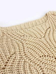 Chic beige hollow knit crewneck sweater with thick textured mesh weave and ribbed neckline