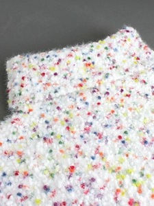 Slim fit high neck cropped knit sweater featuring white colorful confetti mohair yarn