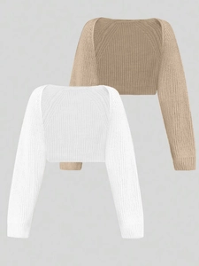 Detailed close-up of long sleeve knit shrugs in white and beige with fine ribbed texture