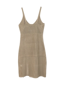 Detailed macro view of khaki knitted dress featuring hollow-out textures and fine straps