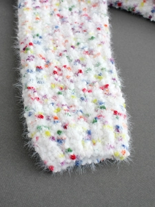 Chic white turtleneck sweater in soft fuzzy mohair with colorful confetti dots