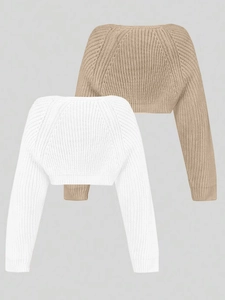 Detail of white and khaki knitted shrug boleros showing ribbed cuffs and V-shaped back