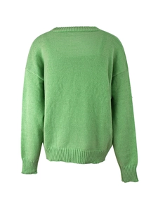 Detail of mint green knit sweater showing ribbing on neckline and shoulder seam