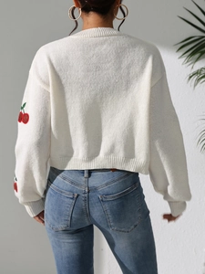White cropped knit cardigan with cherry embroidery and long sleeves seen from behind