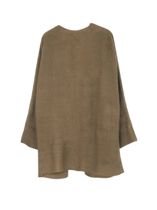 Detailed view of oversized dark brown knit cardigan with ribbed cuffs and soft texture