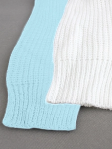 Detail of ribbed knit cuffs in white and light blue for summer vacation beach set