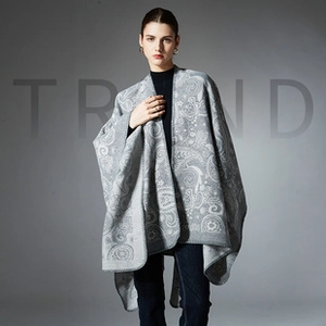 Close-up of grey paisley pattern and knit texture on this elegant open-front shawl