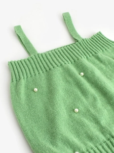 Green knit camisole top with ribbed edges and elegant pearl embellishments