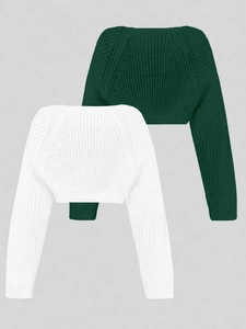 Close-up of knit texture on white and dark green cropped long sleeve beach sweaters
