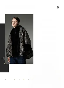 Detailed close-up of a stylish zebra pattern shawl with luxurious faux fur collar and edges