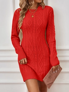 Detailed knit cable texture on a red long-sleeve sweater dress with elegant gold necklace