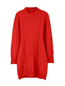 Close-up of cable-knit texture on a red long-sleeved knitted dress with ribbed cuffs