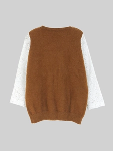 Detail view of brown plush knit sweater featuring white floral lace patchwork long sleeves