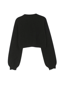 Detailed view of the ribbed round neckline and soft texture of this black cropped knit sweater
