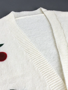 White knit cardigan for women featuring embroidered red cherry patterns and a V-neckline
