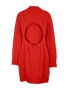Detail of red cable-knit dress featuring a stylish open back and textured fabric