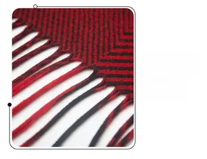 Close-up of red and black geometric jacquard fabric with detailed fringe tassels