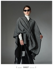 Close-up showing the fine knit texture and black border detail of striped shawl cape