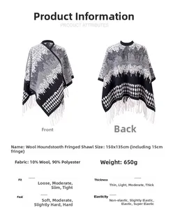 Detail view of black and white houndstooth wool cape with tassel fringe and sizing specs
