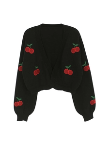 Detailed view of black V-neck knitted cardigan with vibrant cherry embroidery accents