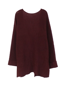 Close-up of deep red oversized knitted cardigan with textured cuffs and roll edges
