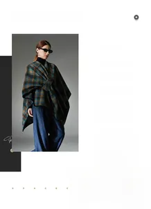 Detail of classic blue and brown plaid shawl wrap with cross collar and black piping