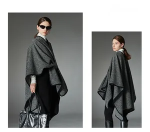 Detail of grey and black striped knit shawl featuring a stylish side buckle closure