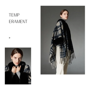 Detail of navy plaid shawl featuring soft faux fur trim and elegant tassel hem finish