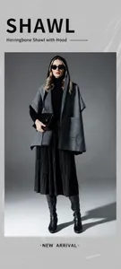 Detailed view of grey herringbone pattern texture and side pocket on the hooded shawl cape