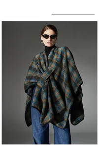 Detail of blue and brown plaid shawl wrap featuring thick fabric and premium draping