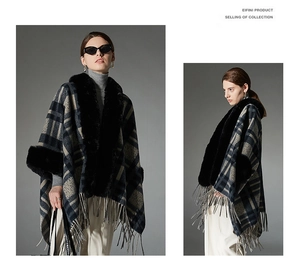 Detail of navy plaid poncho featuring black faux fur collar and long fringe trim