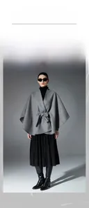 Detailed view of gray double-sided wool shawl with waist belt and elegant cape silhouette