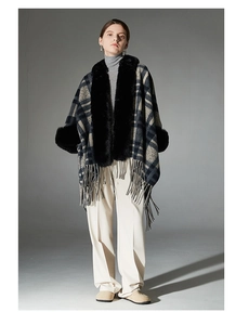 Detailed view of winter navy plaid shawl with faux fur collar and fringed hem design