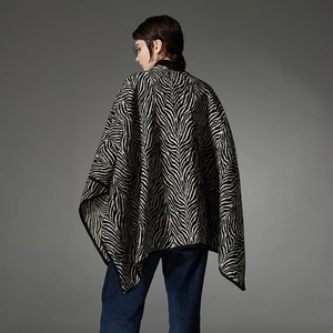 Fashionable zebra print knit shawl with a long silhouette and black contrast edging