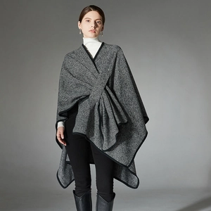 Women's black and white striped shawl cape with buckle detail for elegant autumn wear