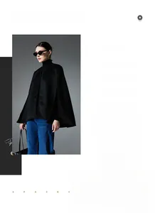 Macro shot of high-quality black wool sleeveless cape jacket with minimalist texture